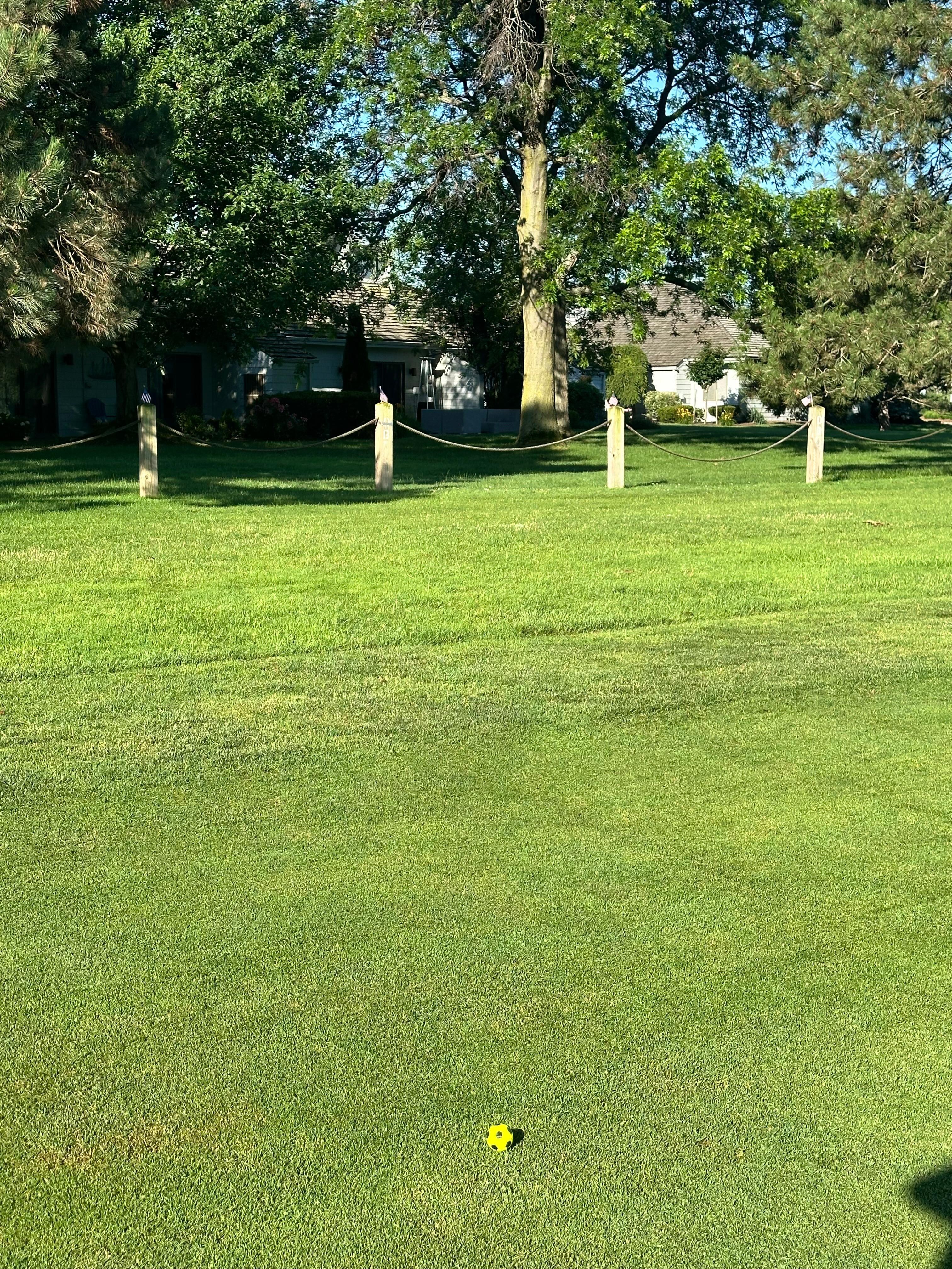 View of back of condo from hole 9 on golf course 