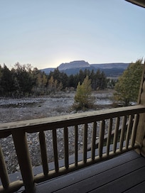 Balcony view overlooking the creek and mountains.