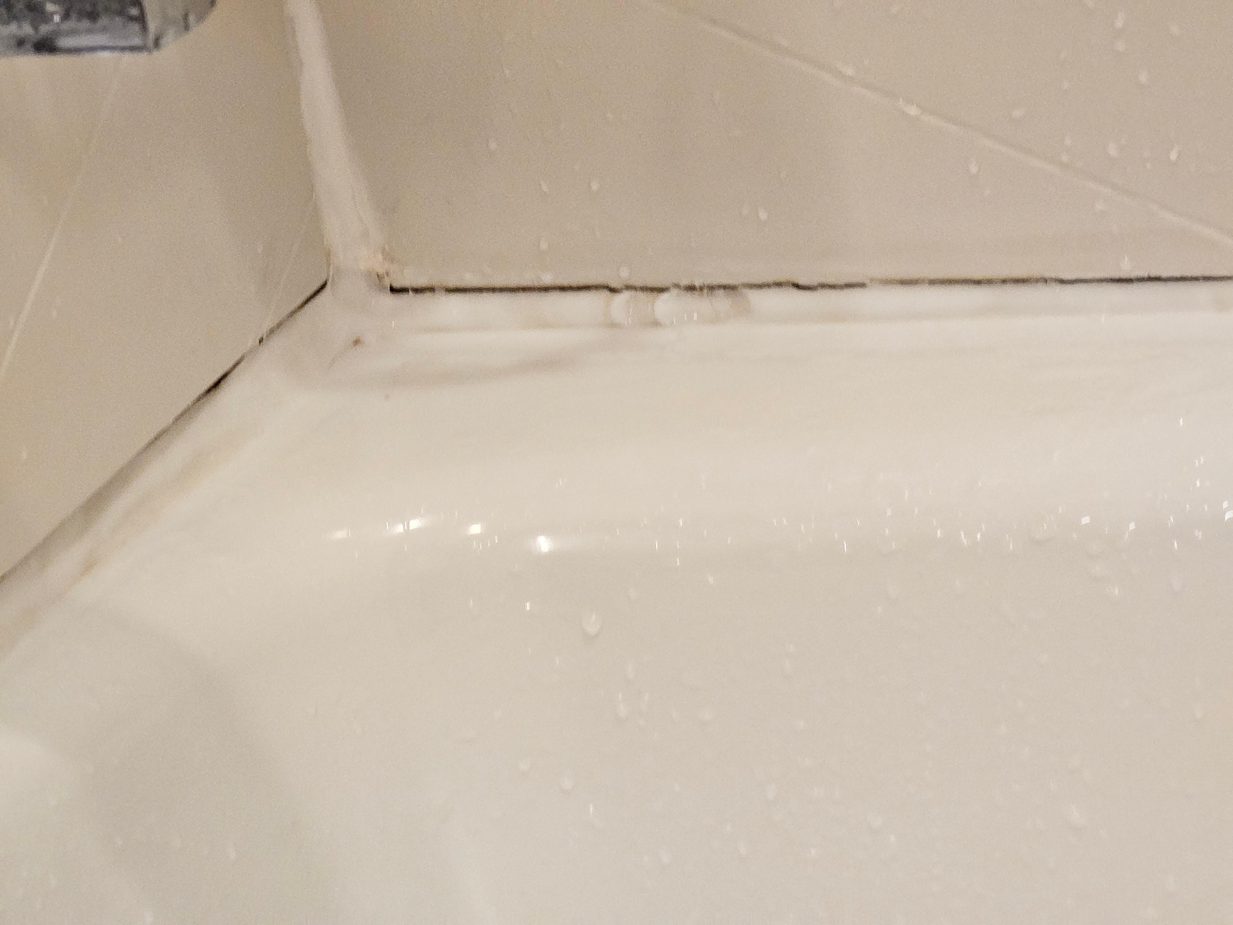 Mold all around bathtub and very slick standing to shower