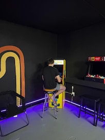 My favorite place! The game room with Galaga/PacMan, pool table and swings!!