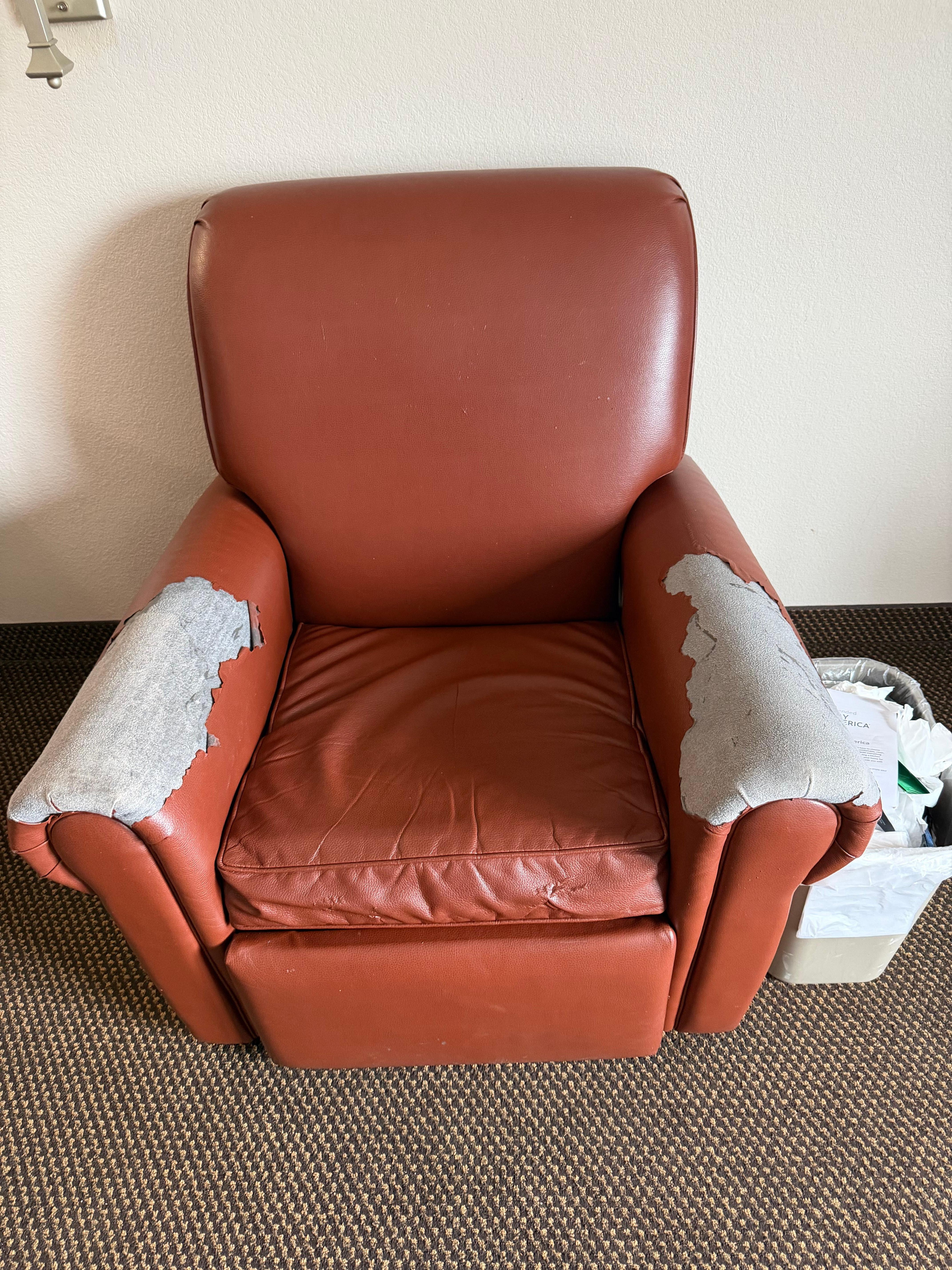 Rundown recliner in room