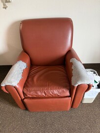 Rundown recliner in room