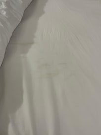 Sheets either stained or dirty