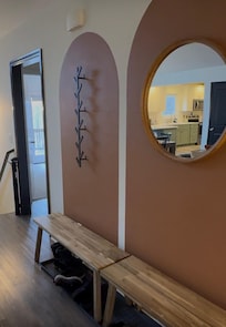 Entrance wall. Benches & boot/shoe trays.