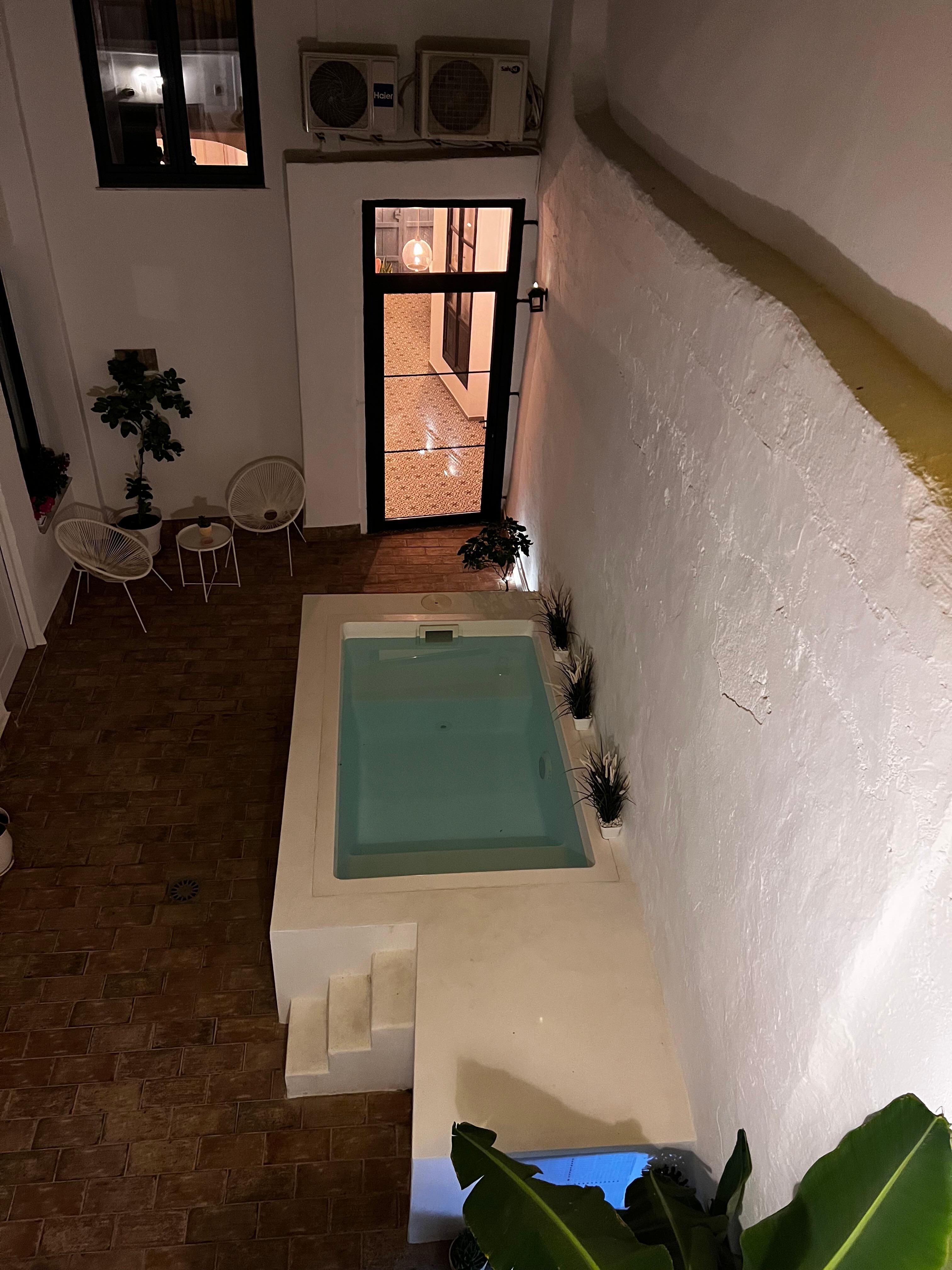 From our terrace you look down on pool and court yard