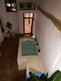 From our terrace you look down on pool and court yard