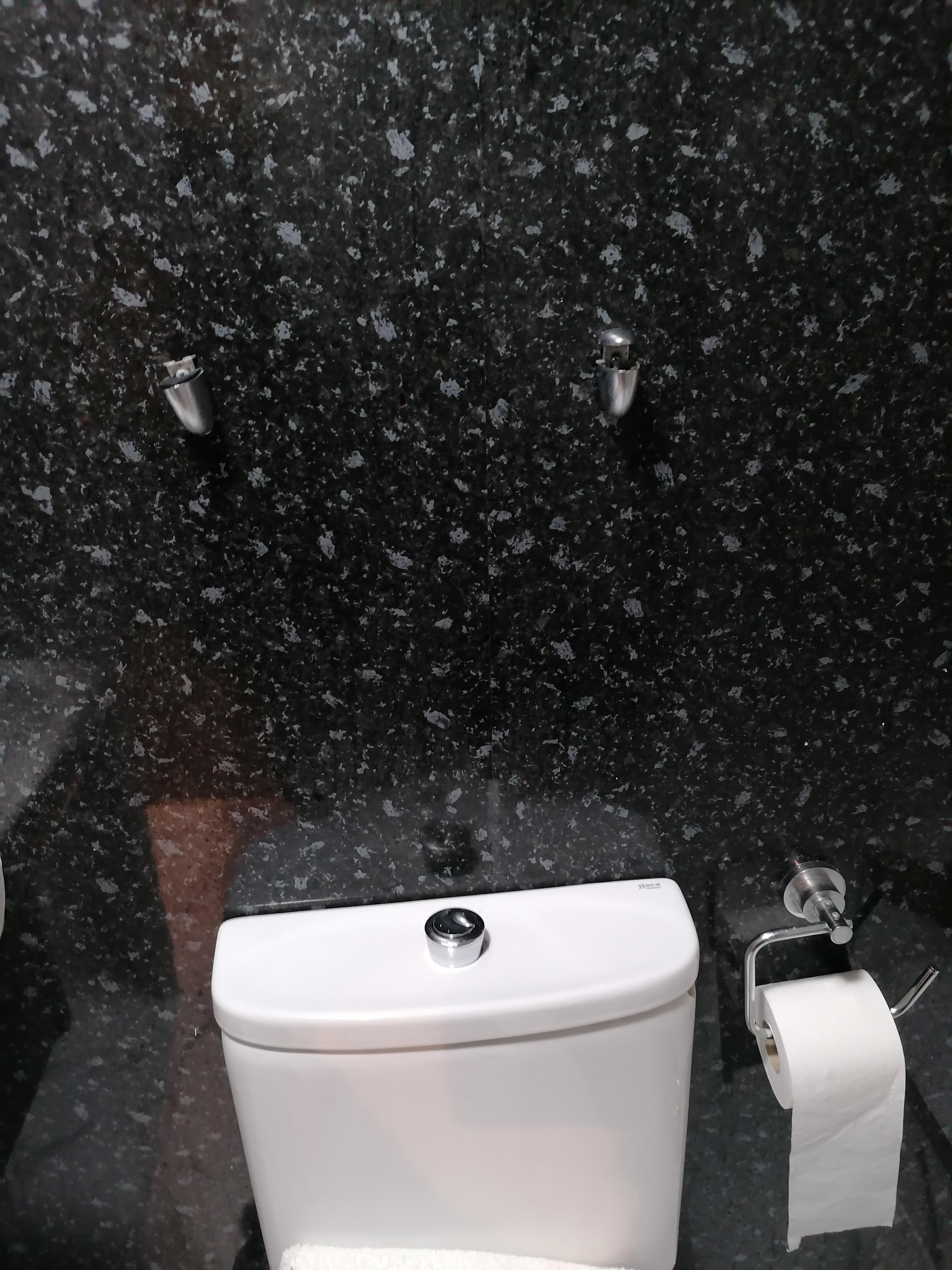 Broken bracket and missing shelf in bathroom