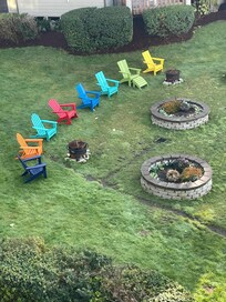 View from balcony of sitting area below in grassy area