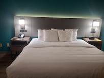 The king bed has night stands on each side, with 2 lights, outlets and USB ports. A separate mood light is behind the headboard.