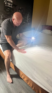 Checking for bed bugs. Didn’t see any, but we itched all night.