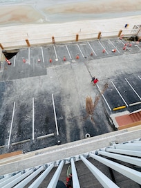 View from balcony down, No access to beach , dirty partial parking area