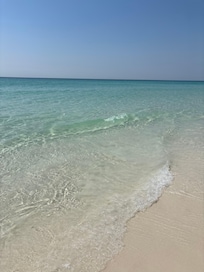 Pristine ocean water and clean, white sand beach! Beach cleaned each morning and beach chairs set out every morning. Grounds and maintenance readily visible and available.