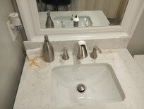 bathroom vanity has rusty stains all over it, needs cleaned off