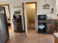 Main floor bedroom & stairs to basement (from kitchen area)