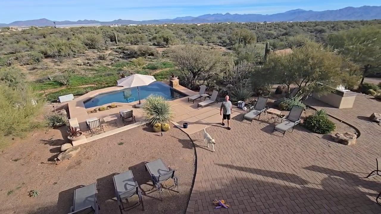 Husband and our dog enjoying the lovely and spacious back yard