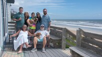 Myself and my wife with our dog, our two sons and their wives, and my granddaughter with her dog.