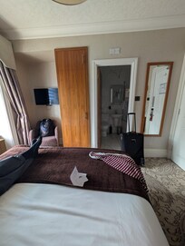 From the head of the bed, you can see the size of the room. Close but comfortable =)