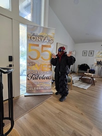 Standing by the Front Door with Living Room behind me. Living Room area is very spacious with fireplace sitting area behind to the left of the Living Room