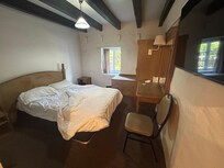 Small room with a terribly musty smell and was also Smokey in pillows. I put a towel over pillow and put essential oils on my hands and held over nose while sleeping. And air conditioner going for five hours while we were out but didn’t help smell.