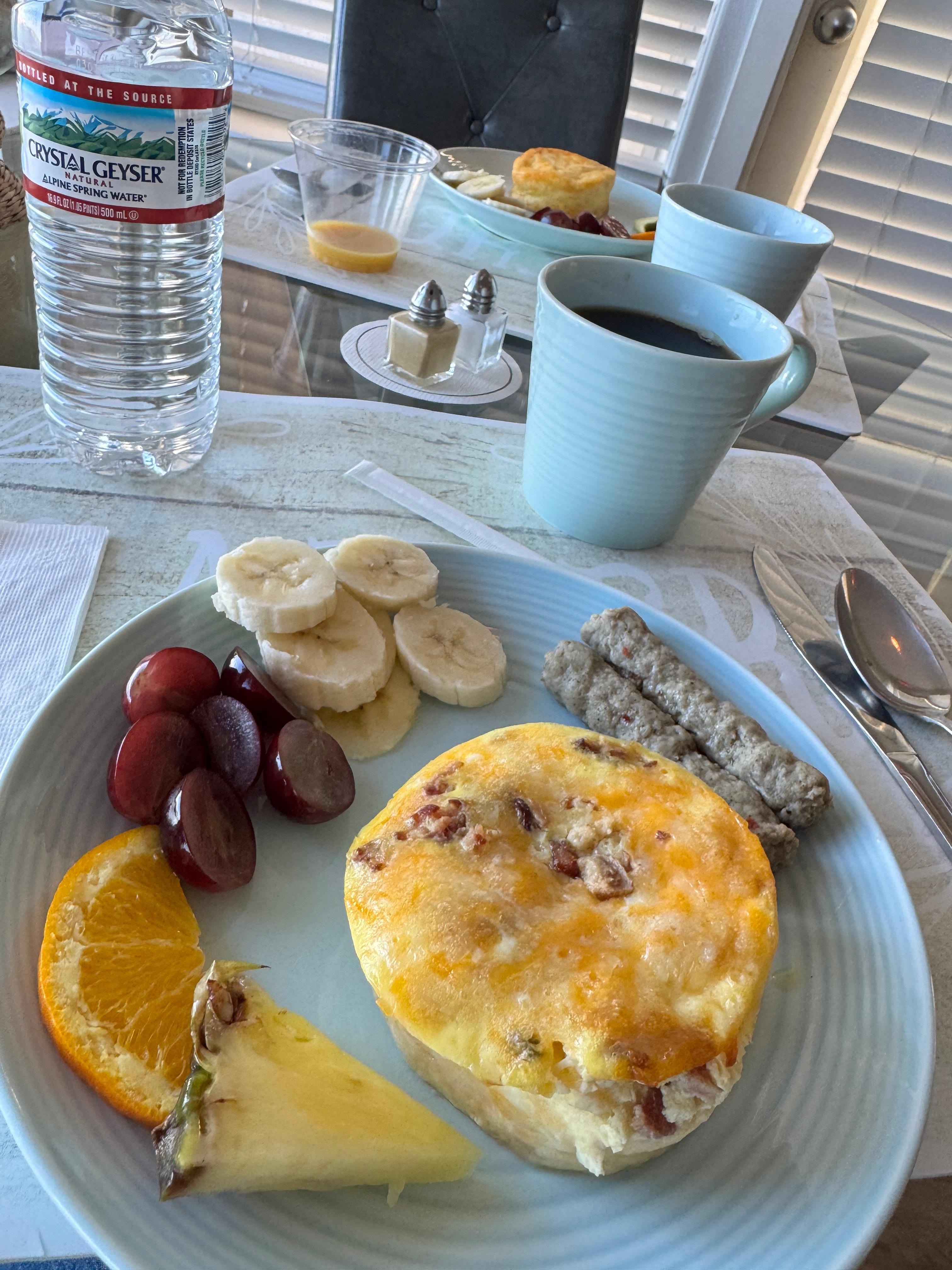 Daily breakfast offered with 2-3 types of quiche, fruit, sausage, juice and coffee.