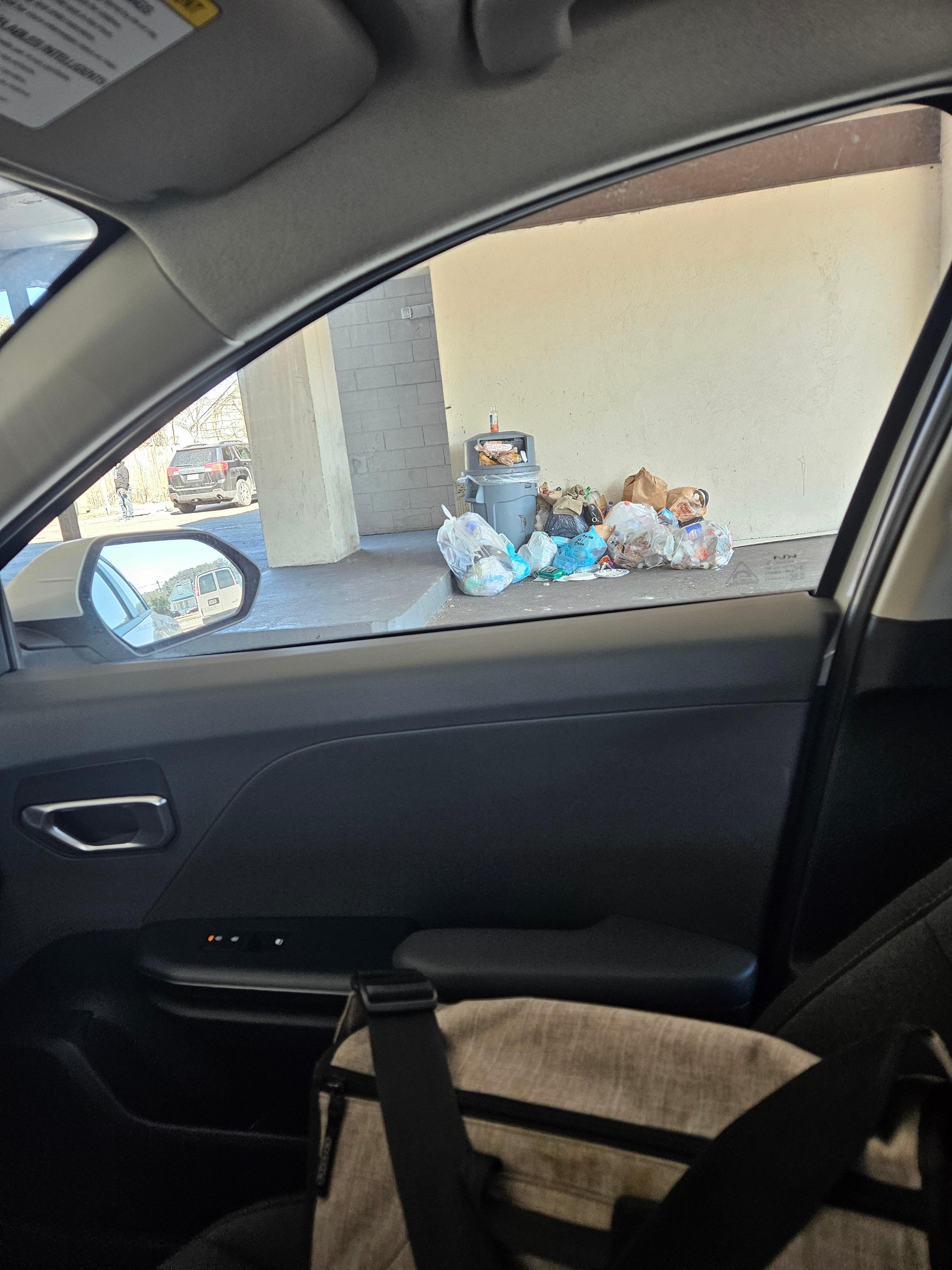One pile of trash next to my car.