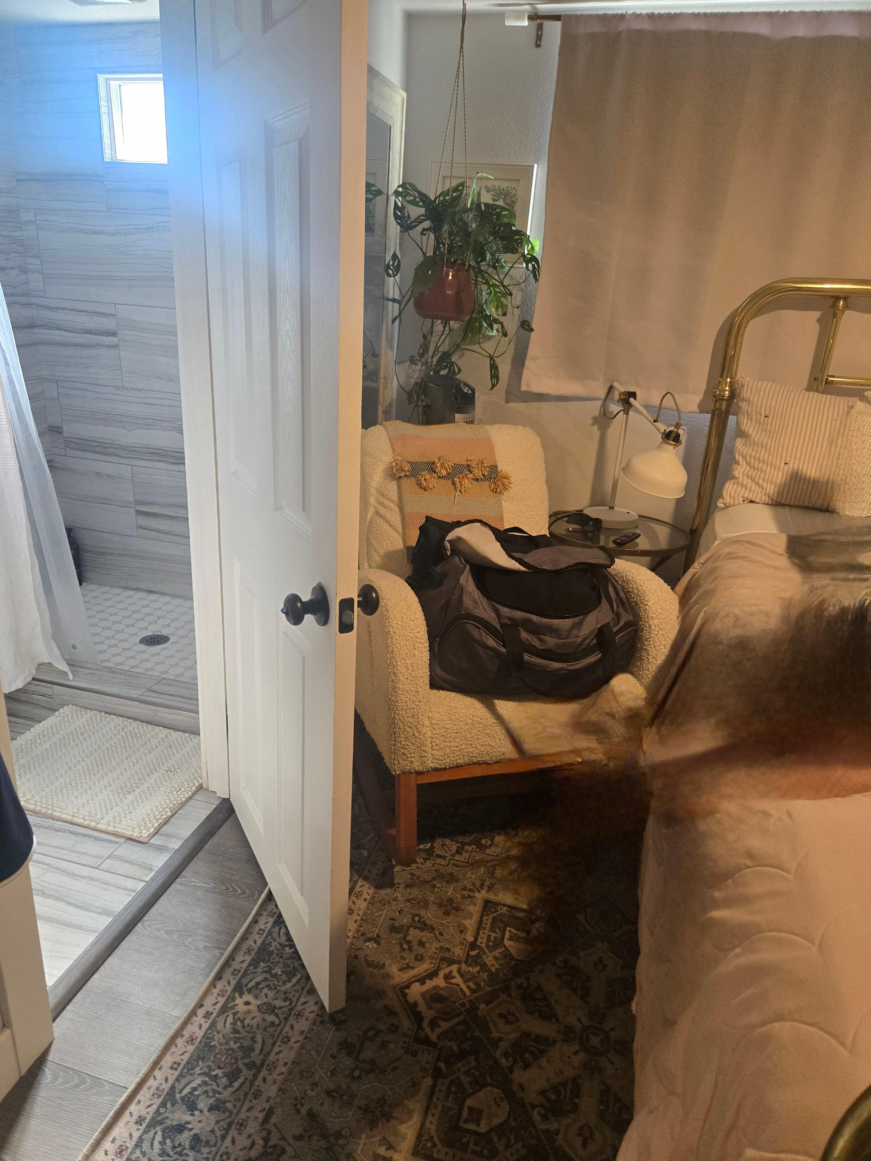 Space between bed and bathroom door