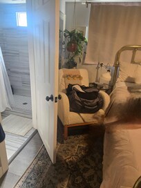 Space between bed and bathroom door