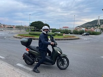 Luca on his scooter finding us a cab