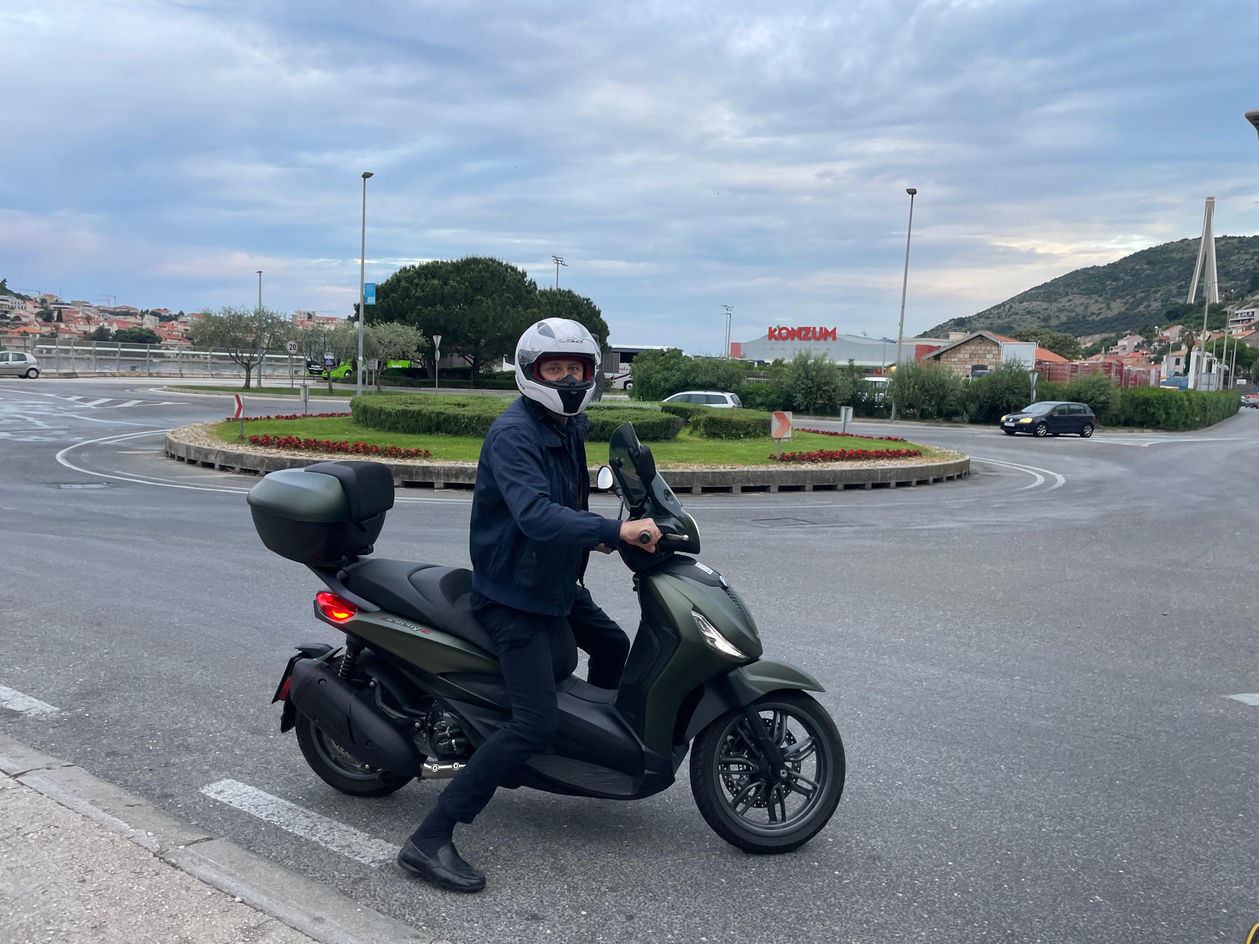 Luca on his scooter finding us a cab