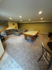 Basement family room with pool table