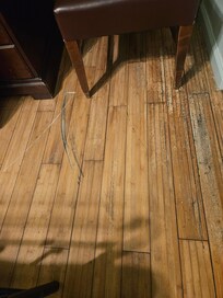 Groove on floor from door being forced open
