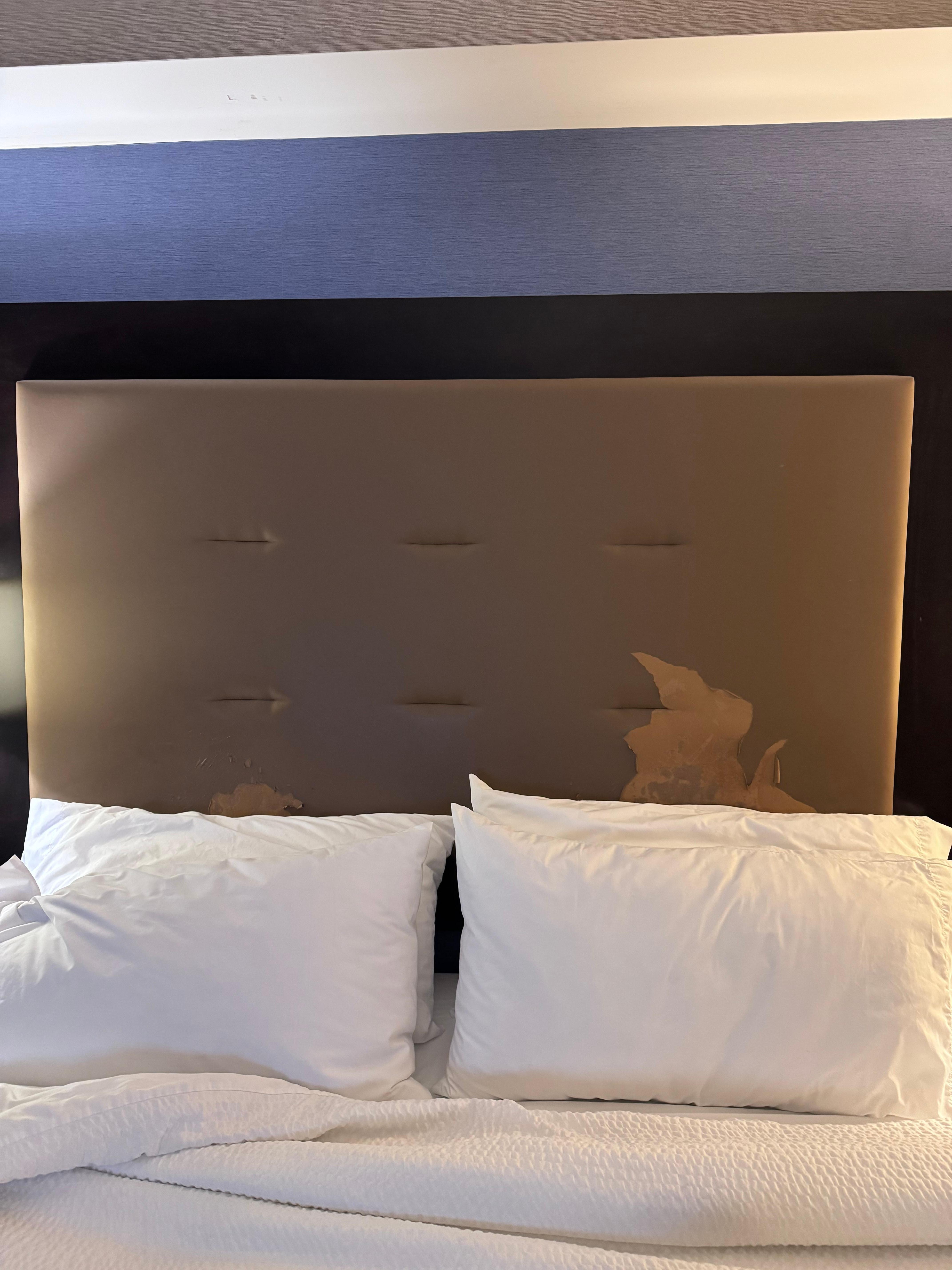 Vinyl on the headboard peeling off.  Worse when you move the pillows.