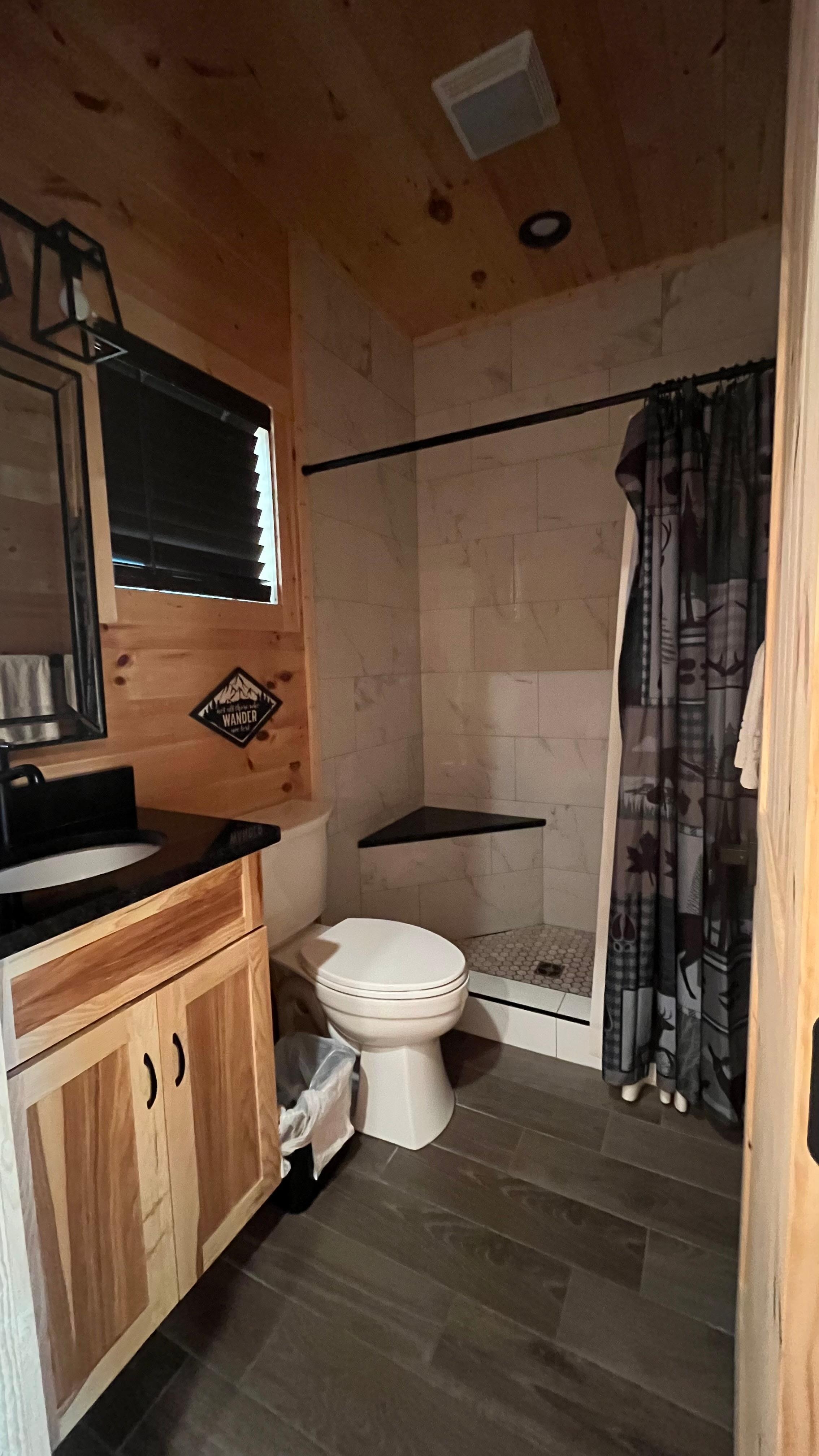 One of two bathrooms with a roomy, modern shower.