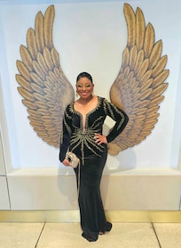 Me dressed for the 9th Annual HAPAwards pictured by the beautiful wall decor near the elevators of the hotel.