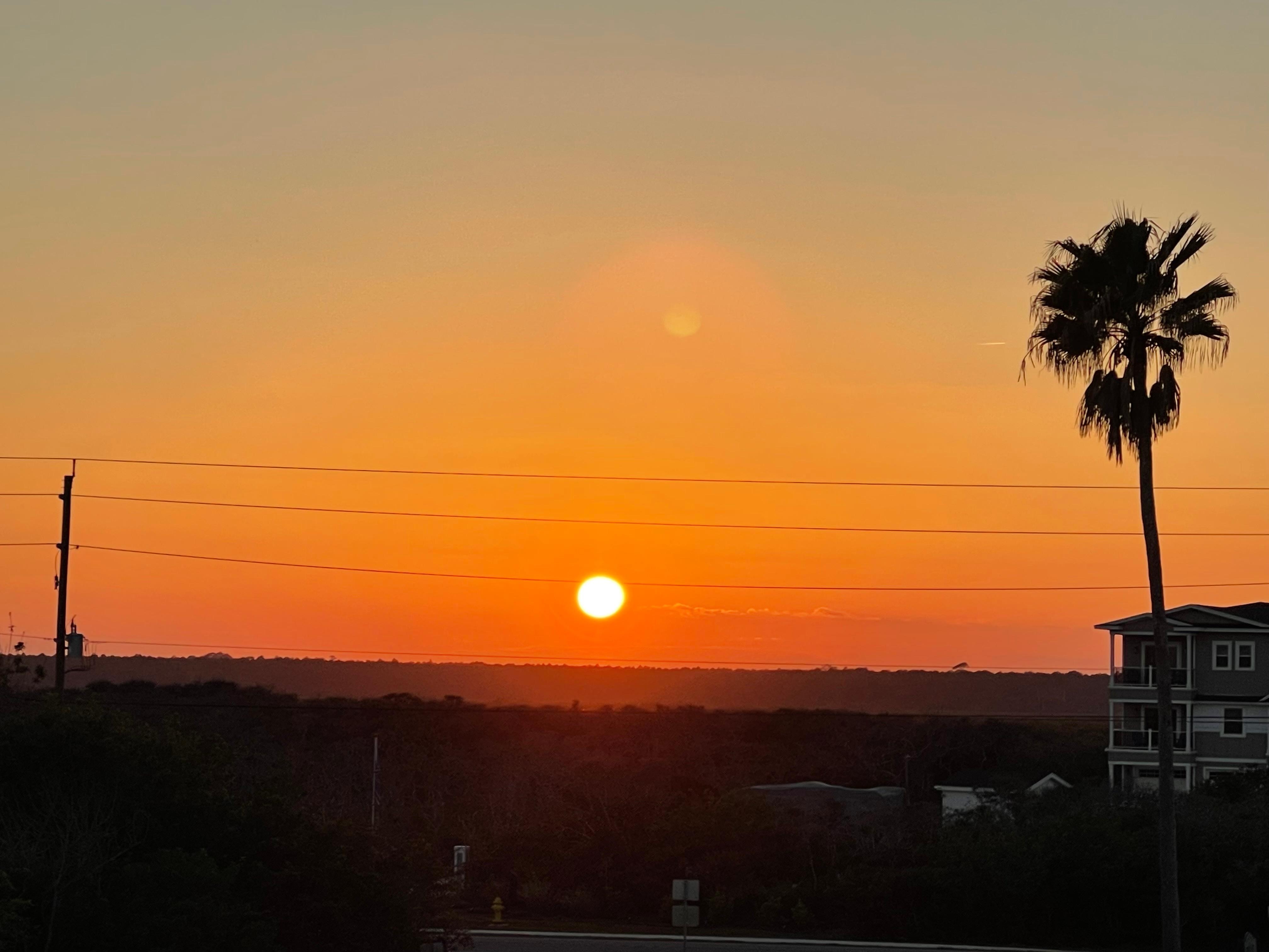 Sunsets across the road viewed from the front steps