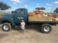 My son at the pumpkin patch on the property.