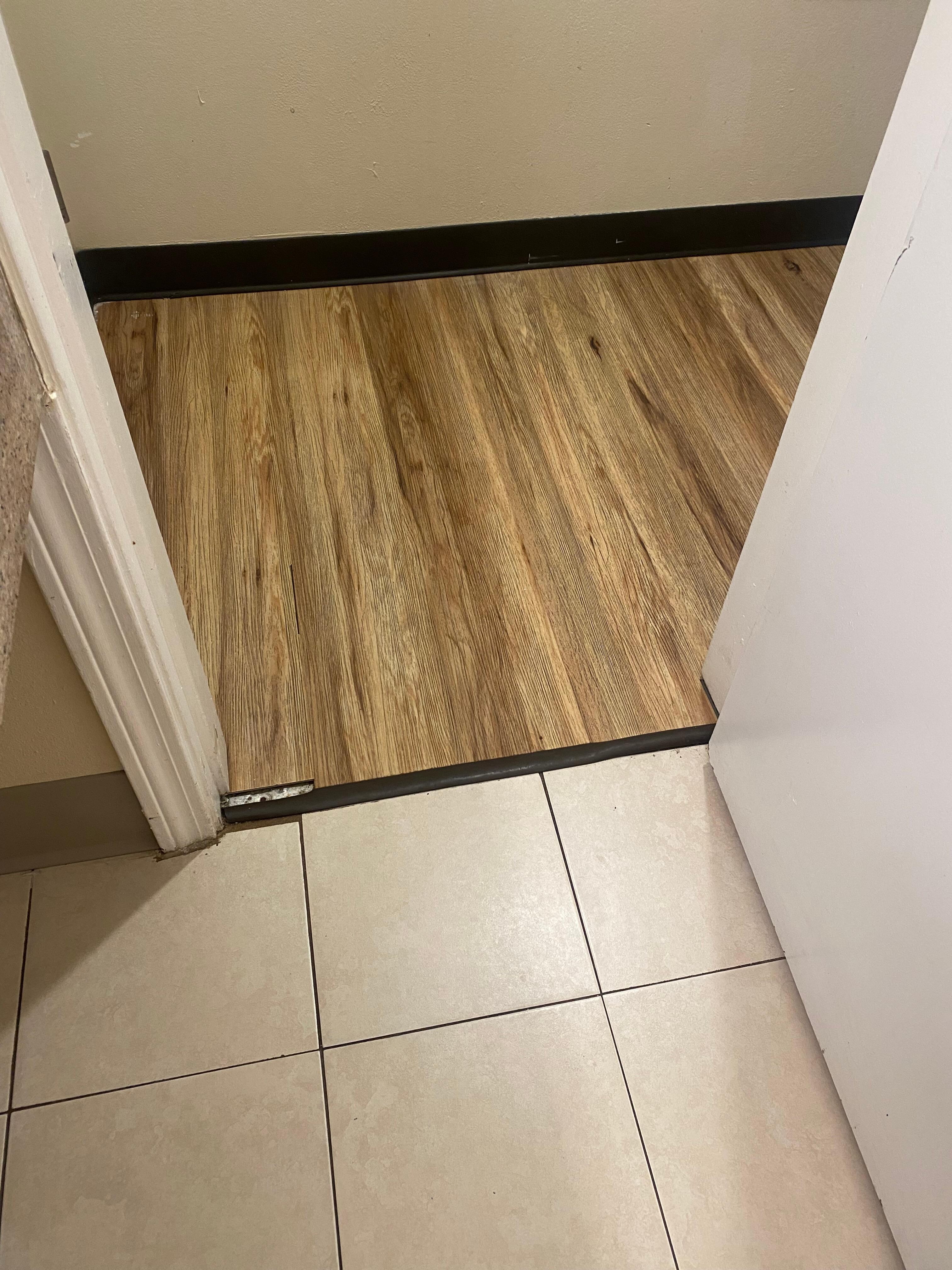 Flooring was vinyl and tile, typical for pet friendly rooms