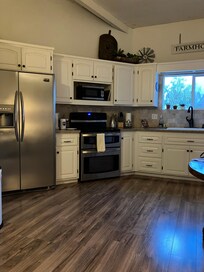 Kitchen is very spacious and clean.
