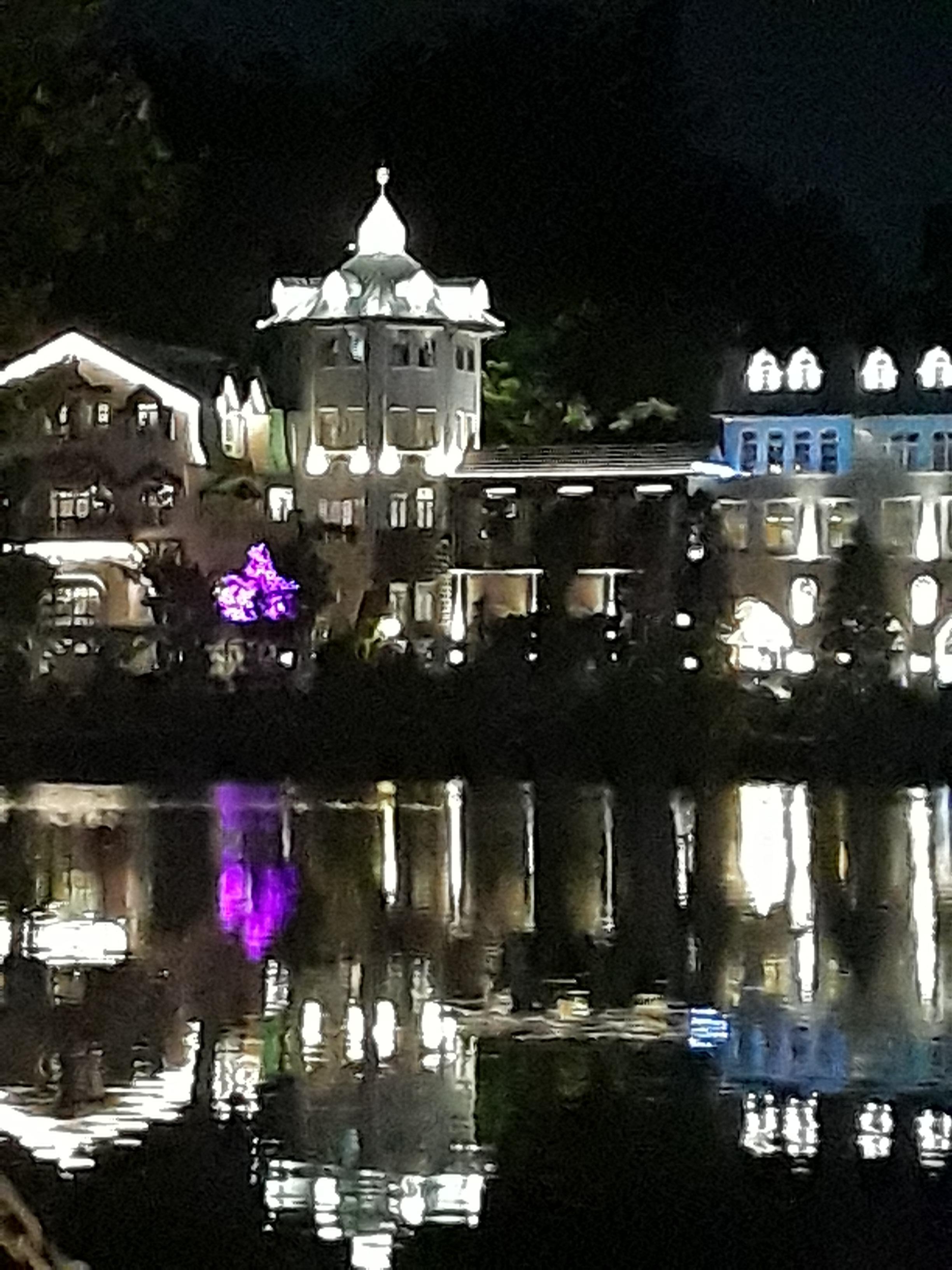 Lakeside mineral bath houses at night