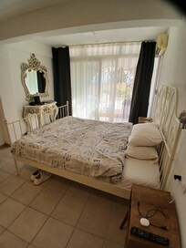 spacious bedroom with patio