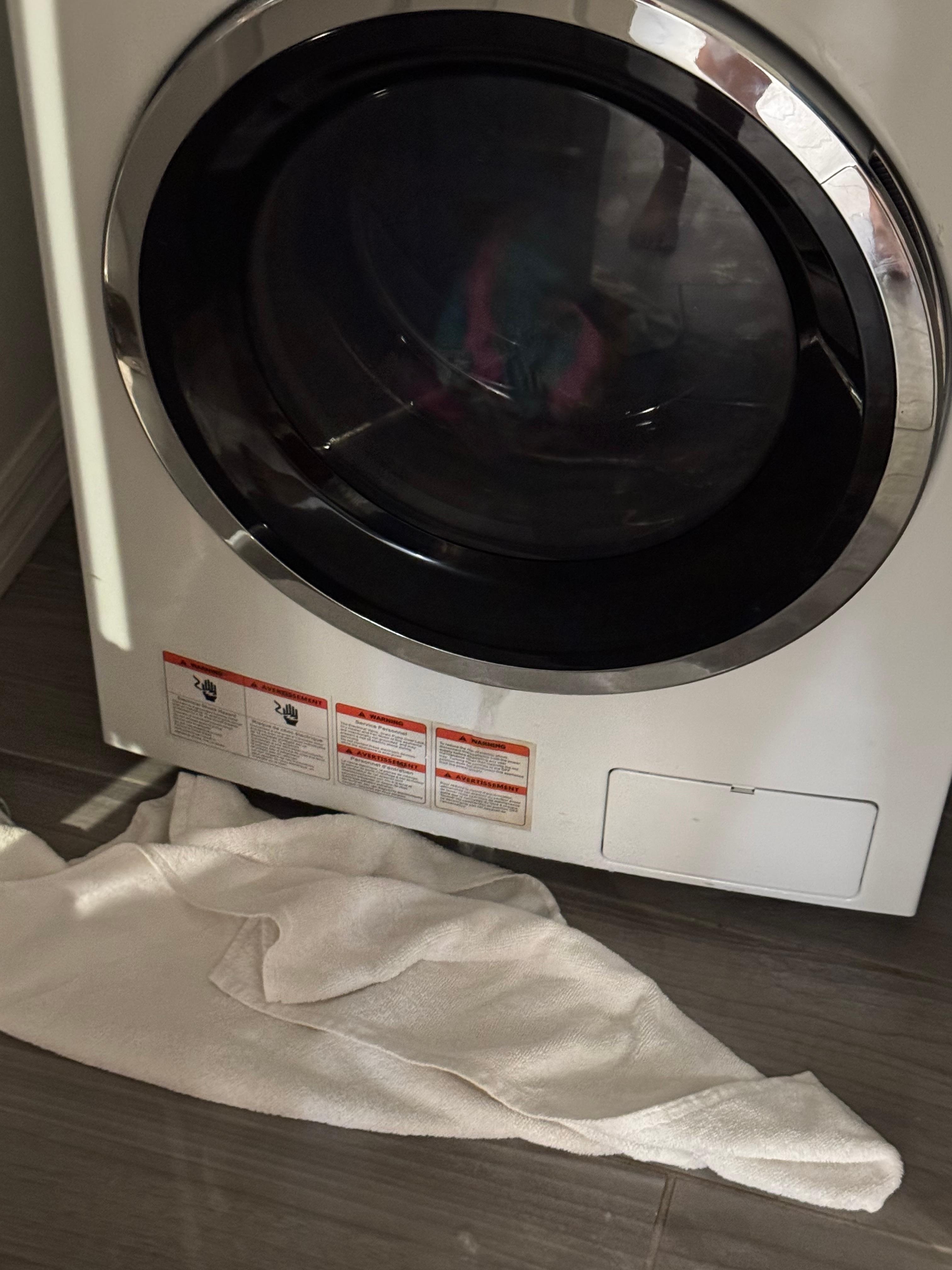 Water pouring out of bottom of door 