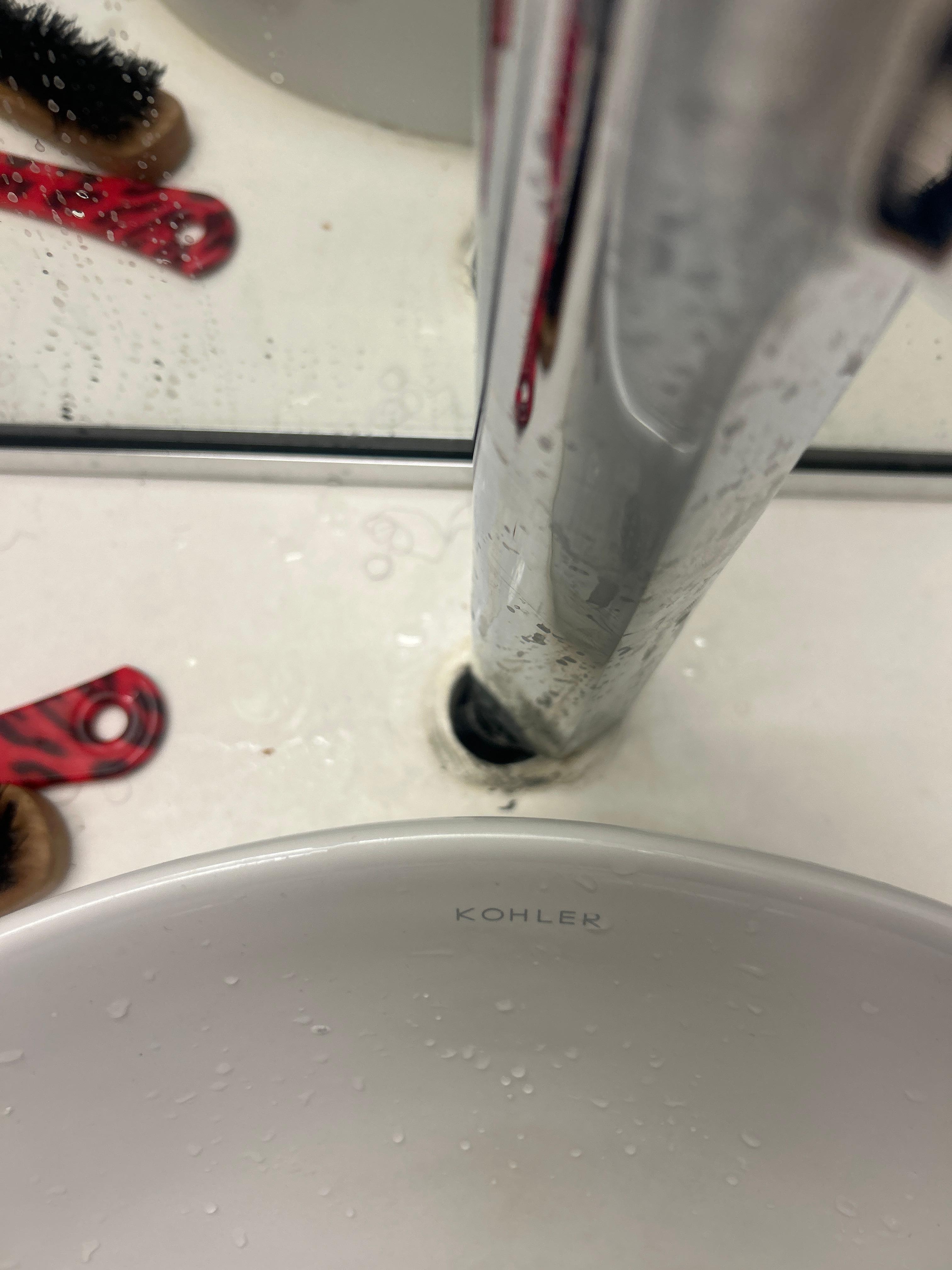 This is the faucet for the bathroom completely loose and not caulked 