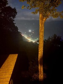 from upstairs balcony night view of maggie below