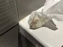 Tissue after wiping top of bath
