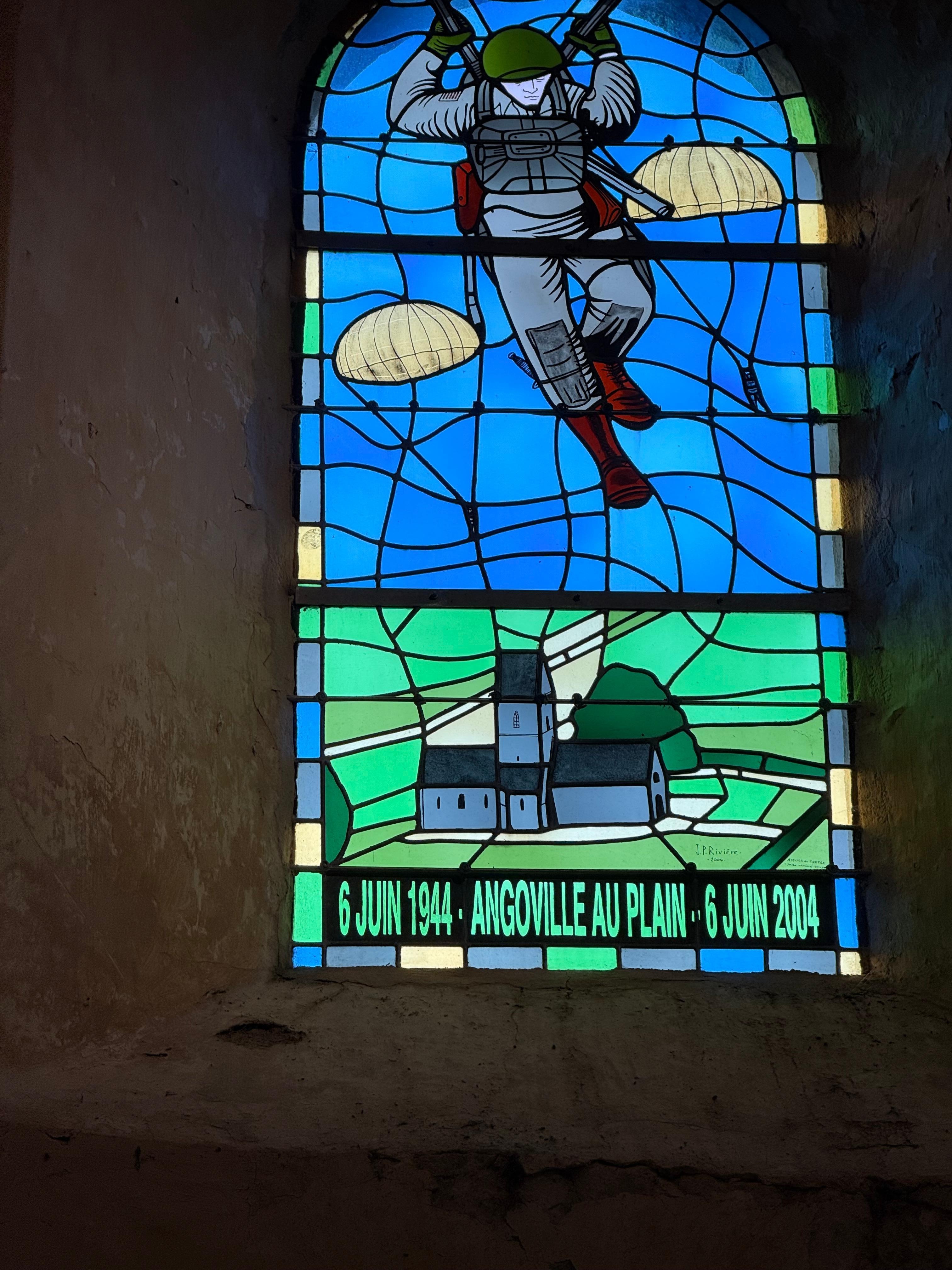 Stained glass window in church honoring US paratroopers