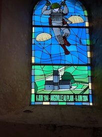 Stained glass window in church honoring US paratroopers