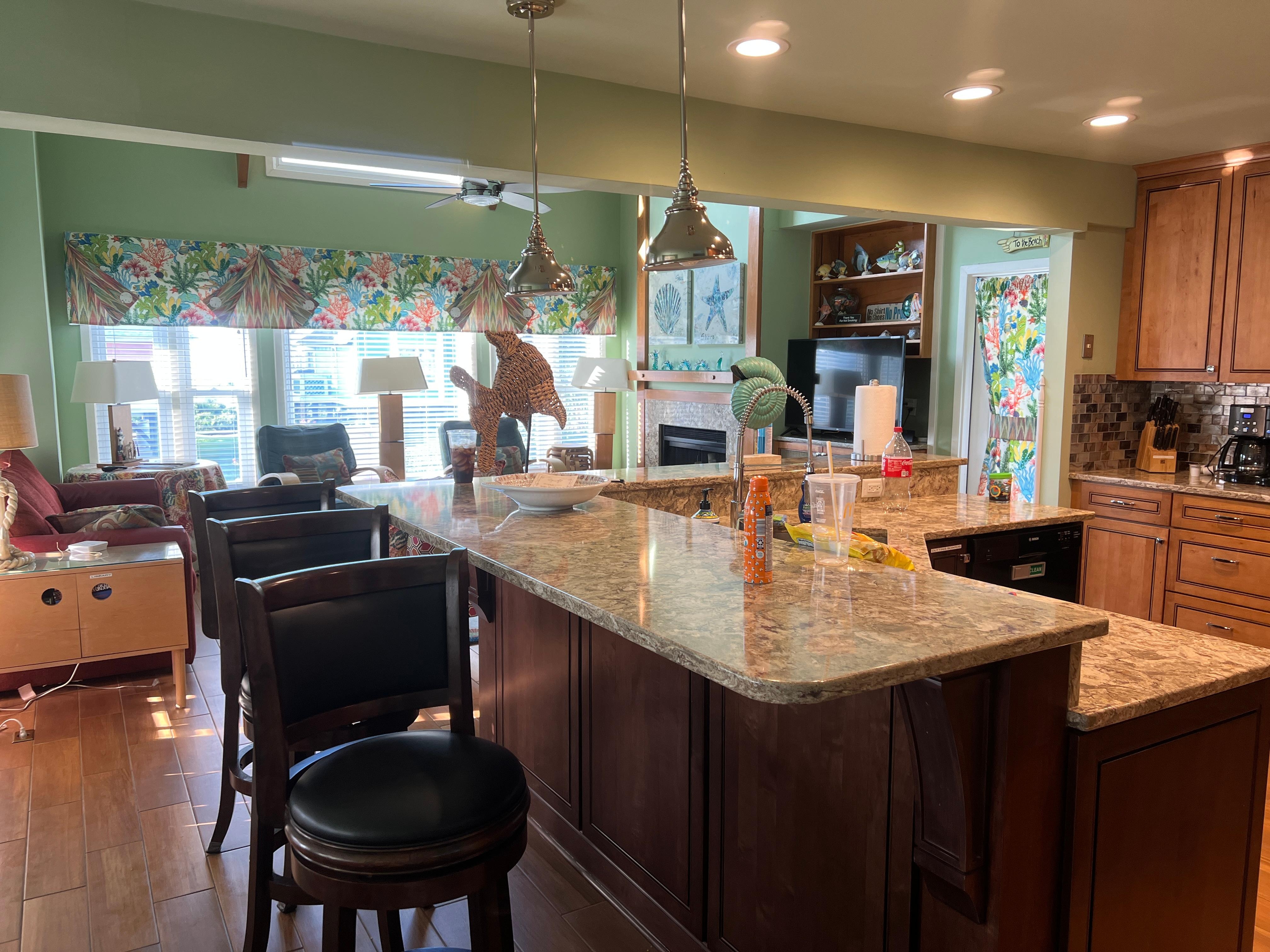 Stocked kitchen, very nice size area and 3 bar stools .