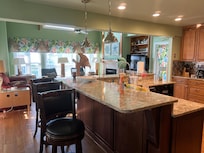 Stocked kitchen, very nice size area and 3 bar stools .