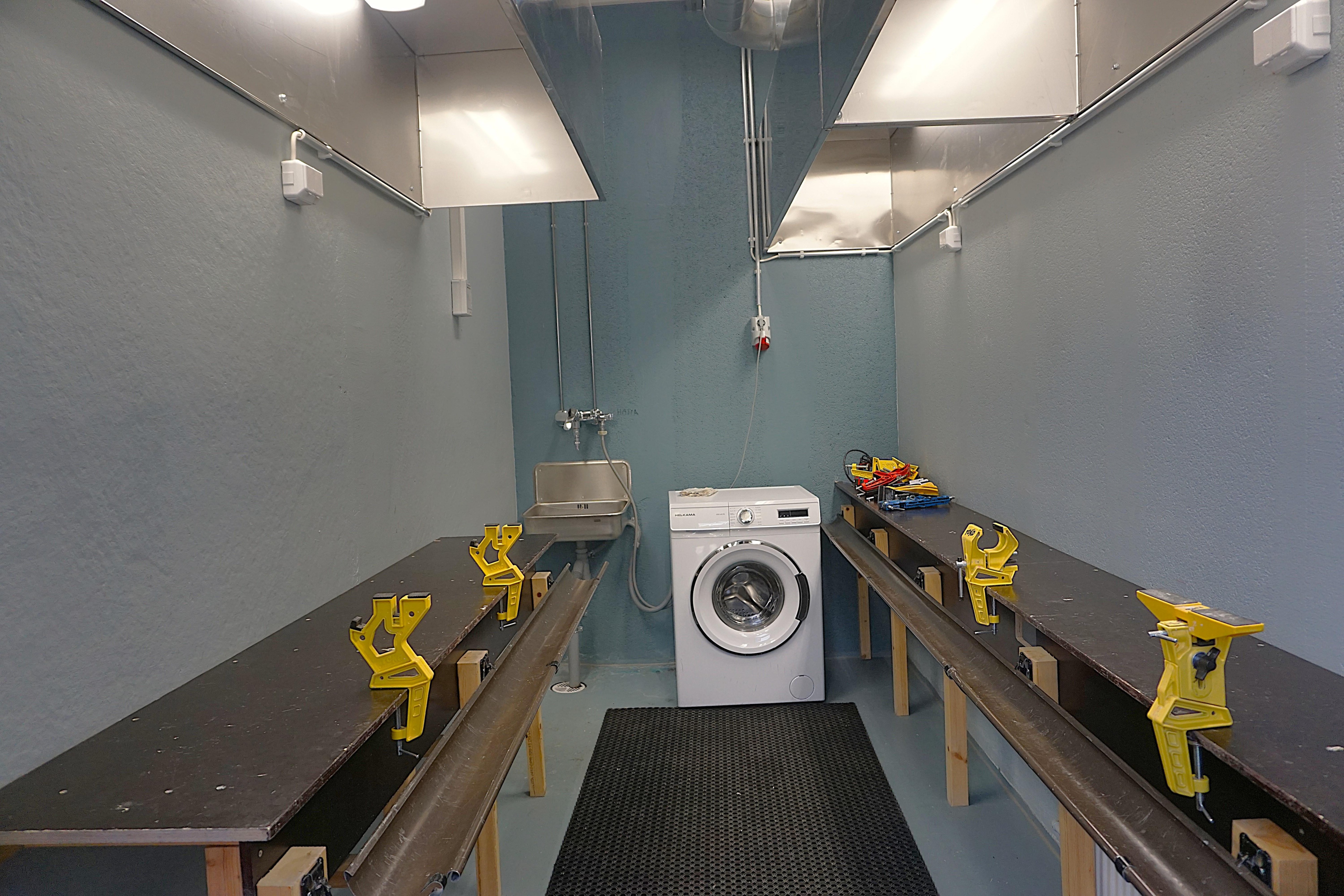 The public ski maintenance room and the laundry (a washing machine)