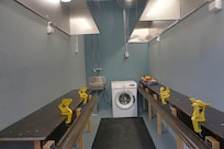 The public ski maintenance room and the laundry (a washing machine)
